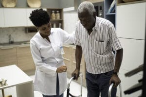 caregiver assisting senior with independence