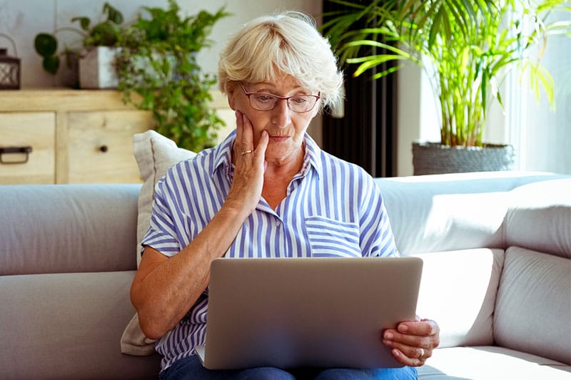 senior-lady-on-laptop-concerned-scam