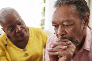 lady comforting husband with Alzheimer's