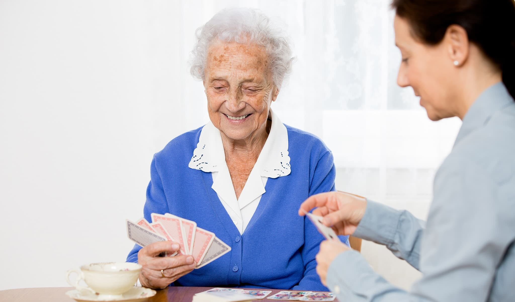 Client and caregiver playing cards