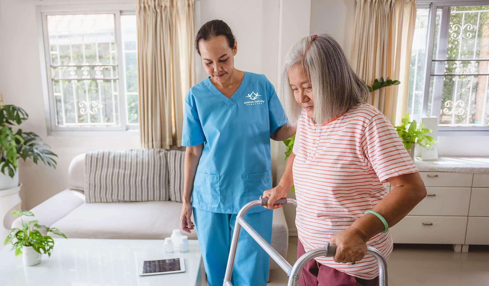 Caregiver helping senior client using a walker