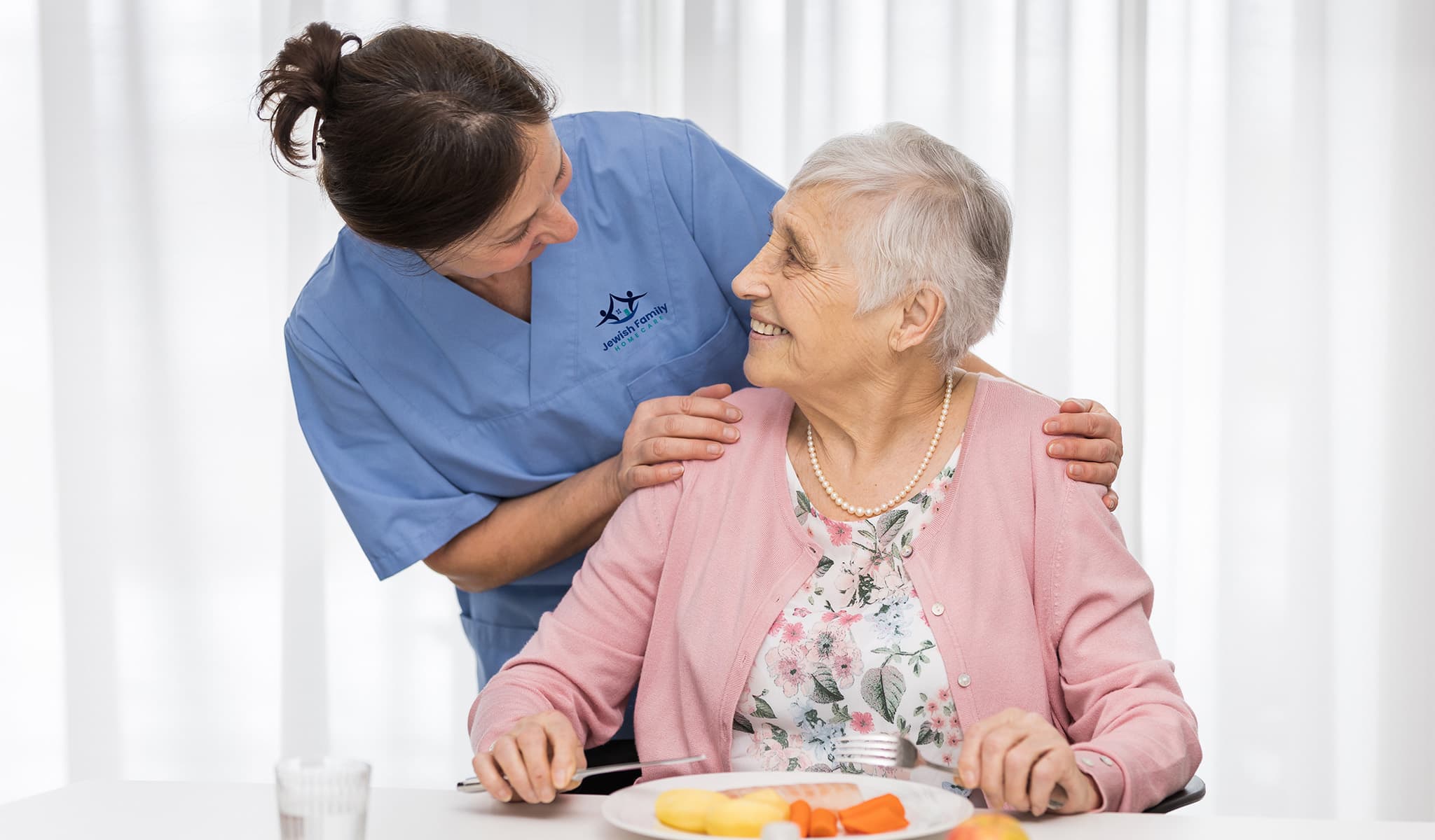 Caregiver and client at mealtime